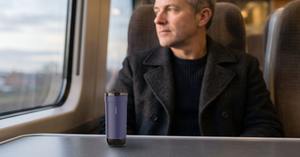 VSITOO S5 heated travel mug on a commuter train tray table